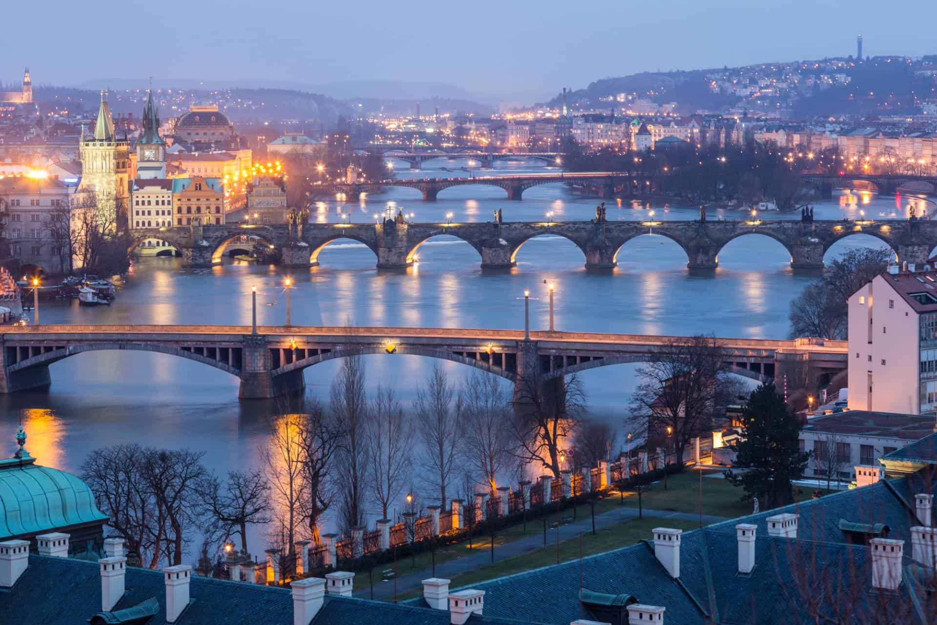 Prague at twilight, view of bridges on Vltava River.