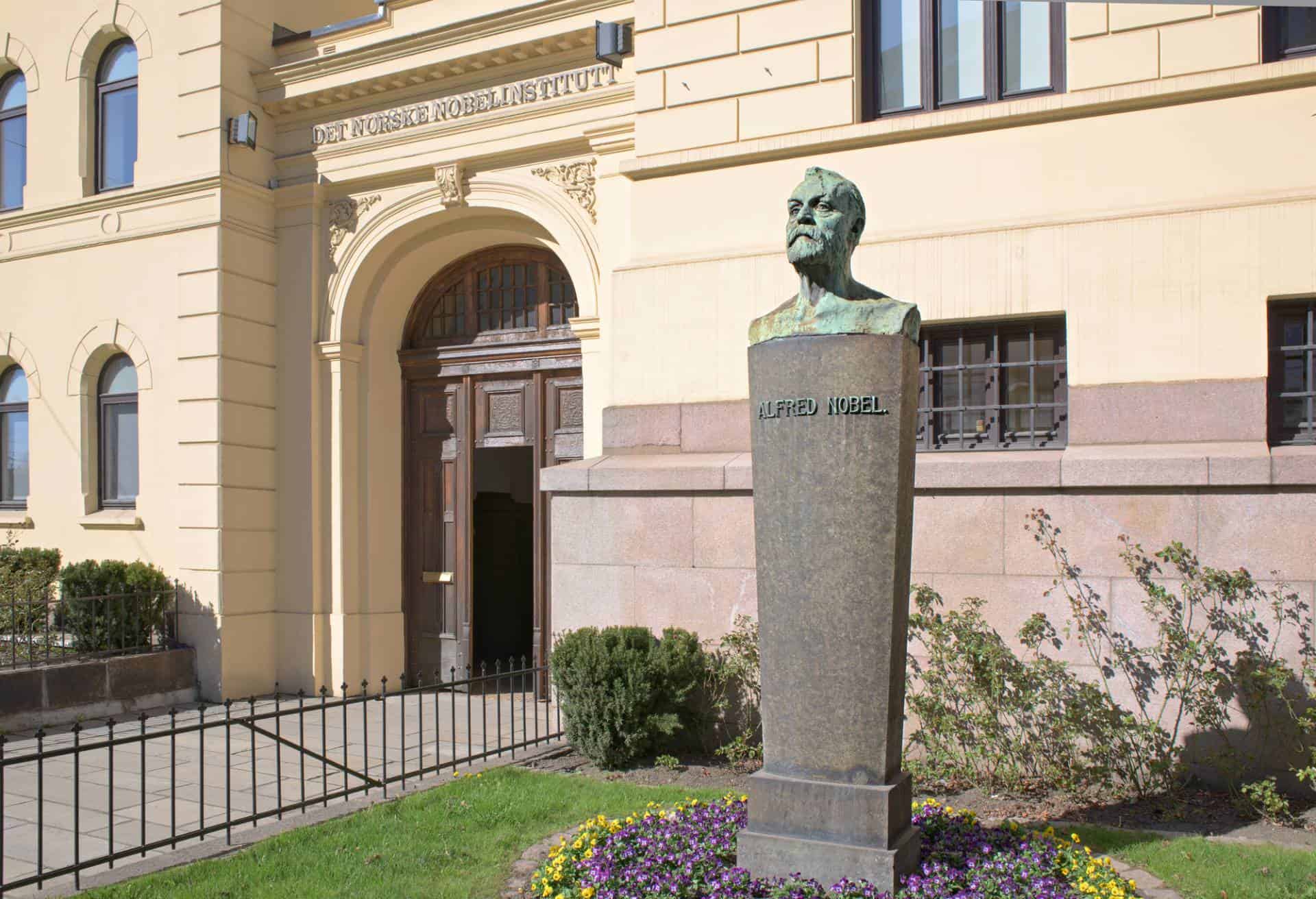 Entrance of the Norwegian Nobel Institute In Oslo, Norway with a bust of Alfred Nobel in the foreground.