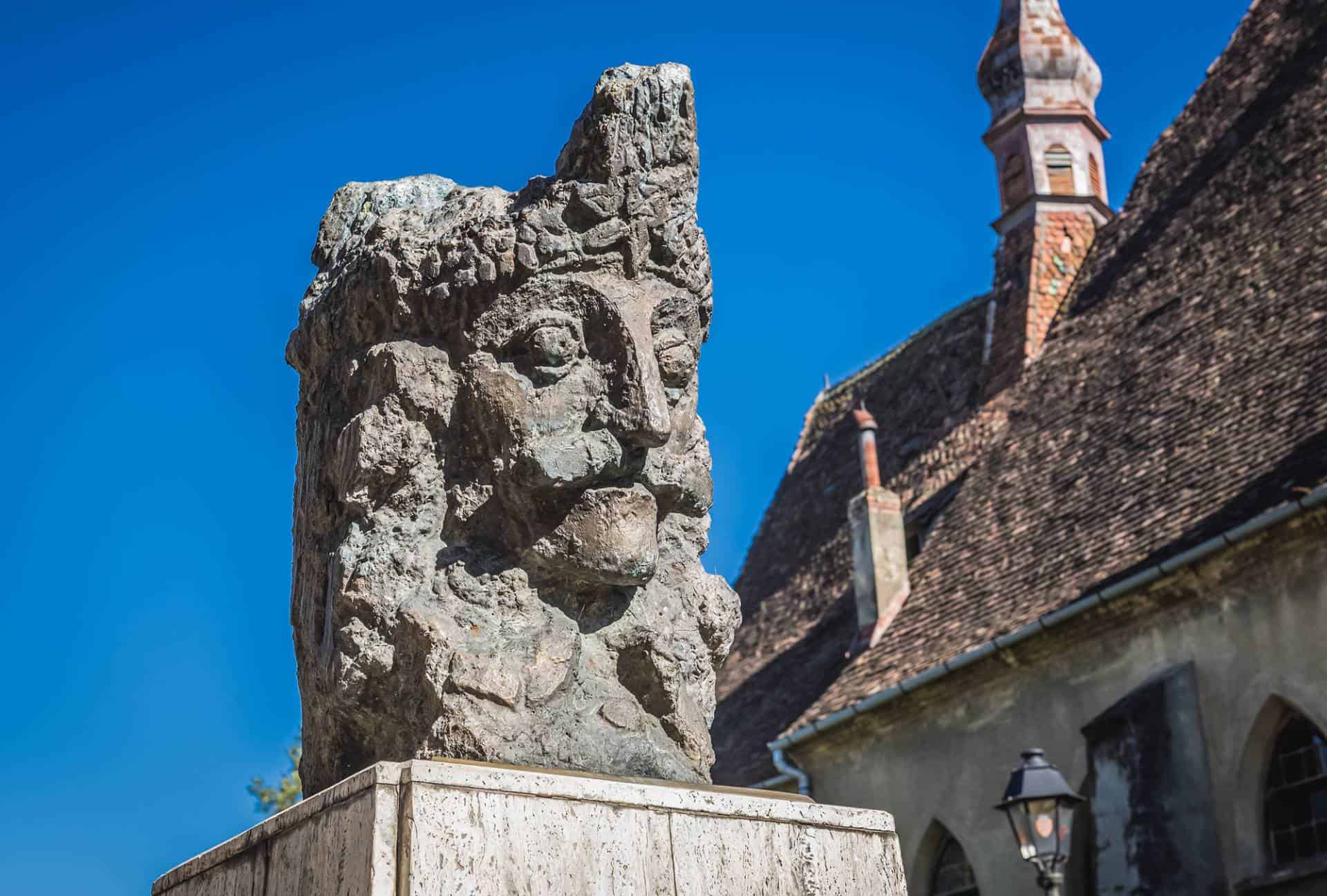 Statue of Vlad the Impaler in front of the Dominican Monastery Church in Sighisoara, Romania.