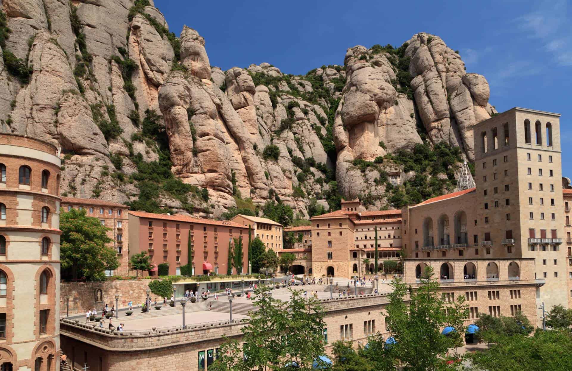 View of multi-peaked mountain range and Montserrat near Barcelona, in Catalonia, Spain. Site of the Benedictine abbey, Santa Maria de Montserrat, which hosts the Virgin of Montserrat sanctuary.