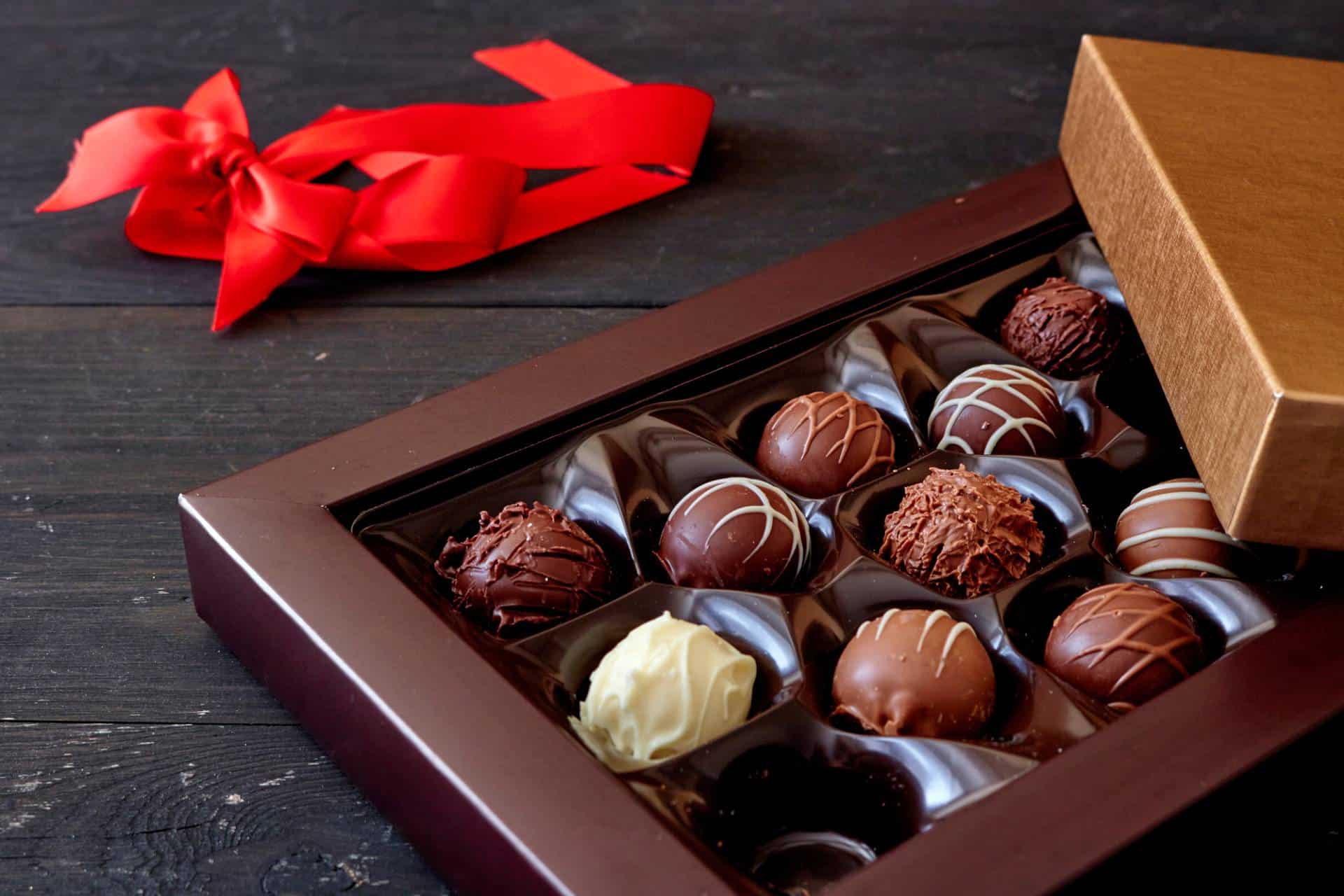 An open gift box of assorted chocolates.