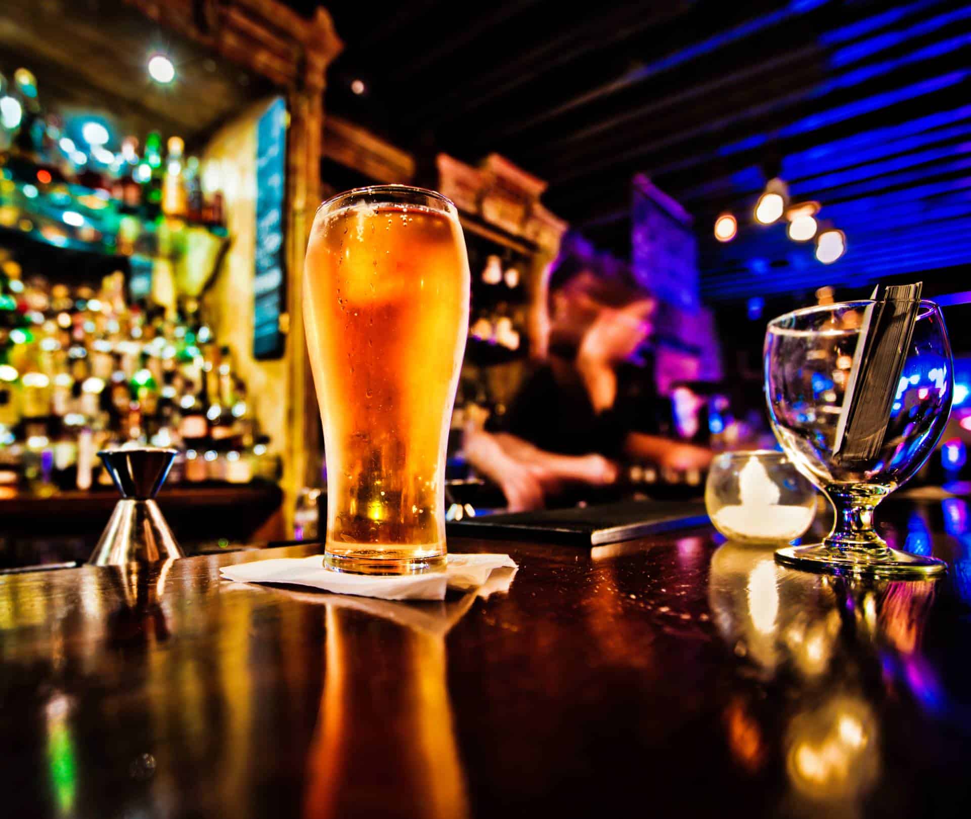 Pint of beer on a bar in a traditional style pub.