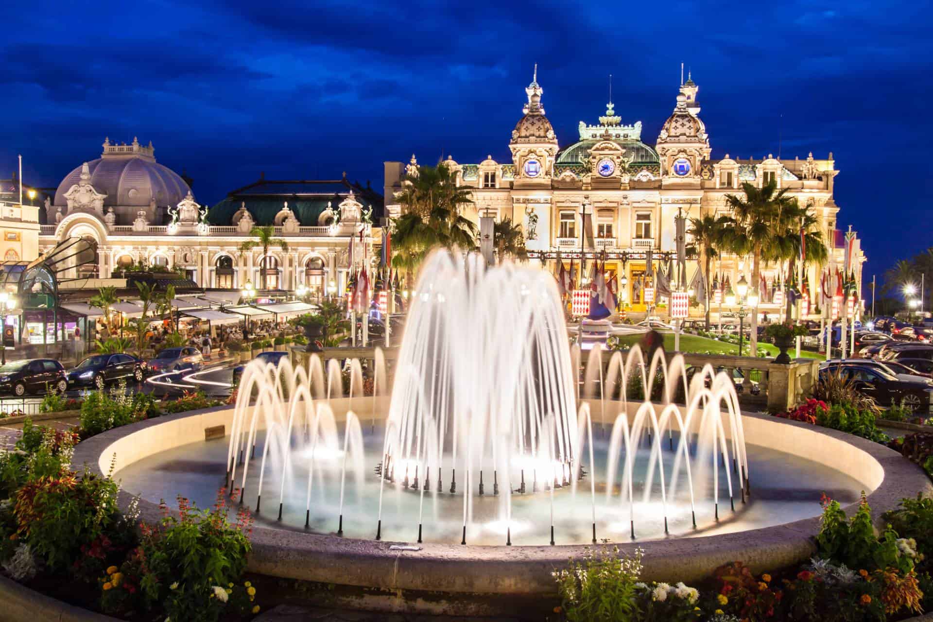 Night view of Casino de Monte-Carlo, Monaco with fountain in the foreground