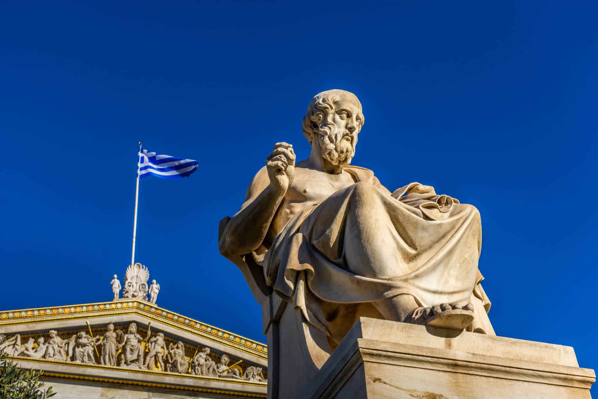 Close up view of a statue of the Greek philosopher Plato in front of the Academy of Athens in Greece