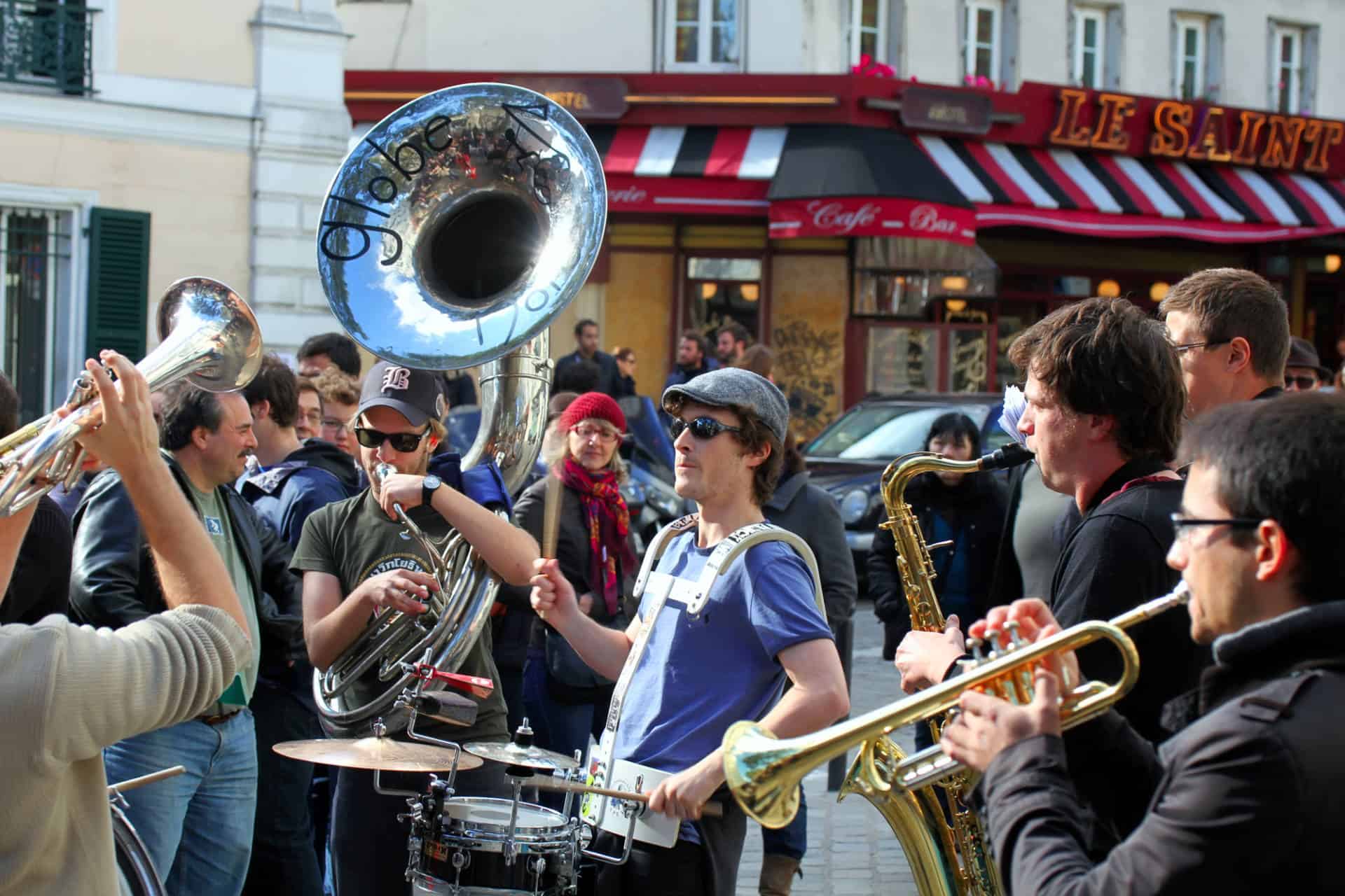 Group of young musicians playing music at Montmartre in Paris
